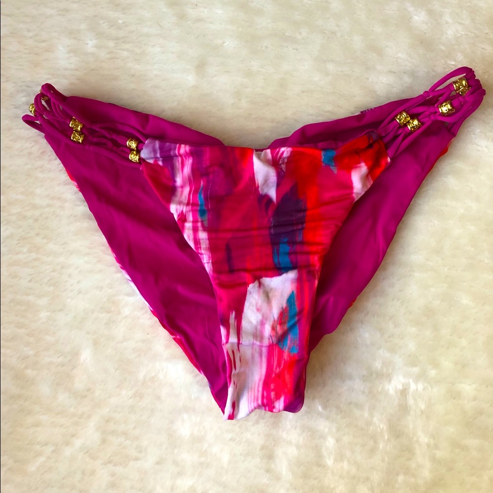 Reversible Beach Bunny Bikini Bottoms with gold hard wear detail, size medium.